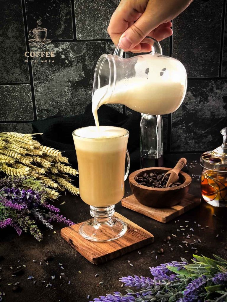 Top the honey lavender latte with frothed milk.