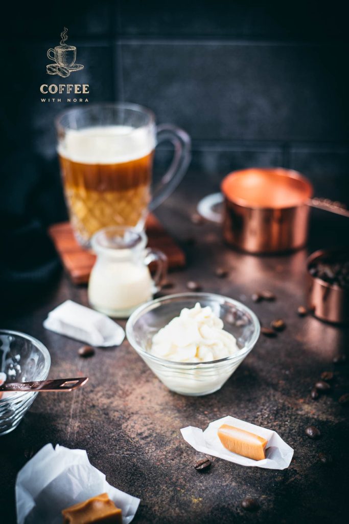 Whipped coffee creamer in small glass bowl.