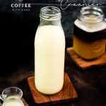 Big glass bottle filled with homemade coffee creamer.