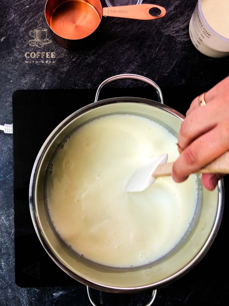 The volume of the milk mixture should be reduced by half.