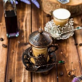 Soothing lavender latte in gorgeous medieval cup.