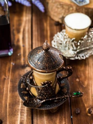 Soothing lavender latte in gorgeous medieval cup.