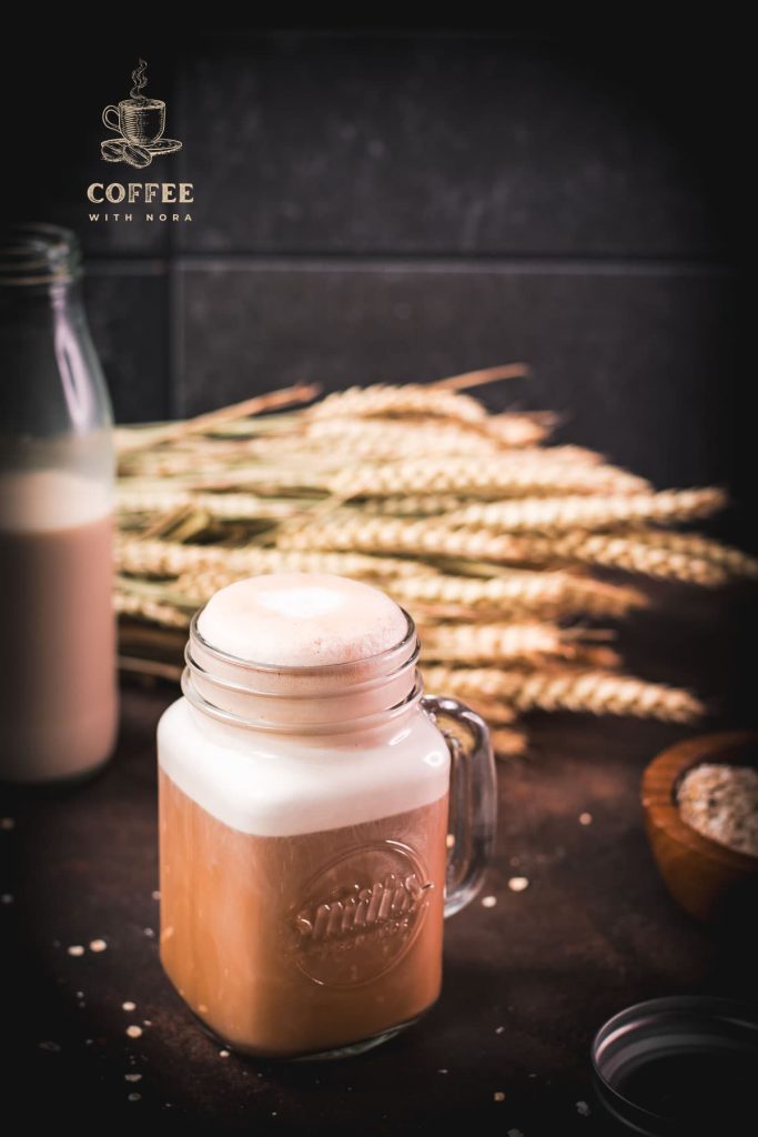 Mason jar filled with comforting oat milk coffee. So good!