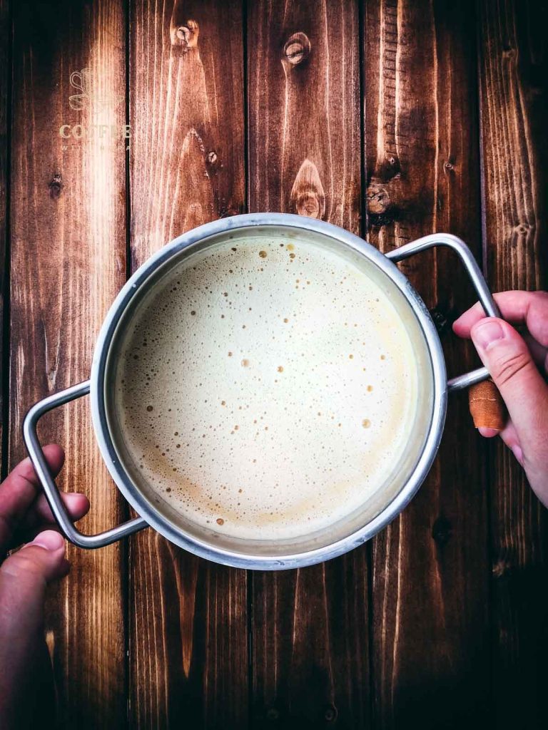 Finished prepared salted caramel coffee creamer in small saucepan before cooling.