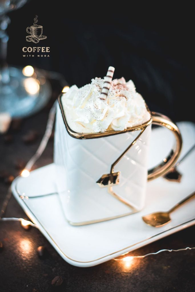 Gorgeous eggnog coffee, served in a handbag coffee mug. Topped with whipped cream and garnished with cocoa powder or nutmeg.