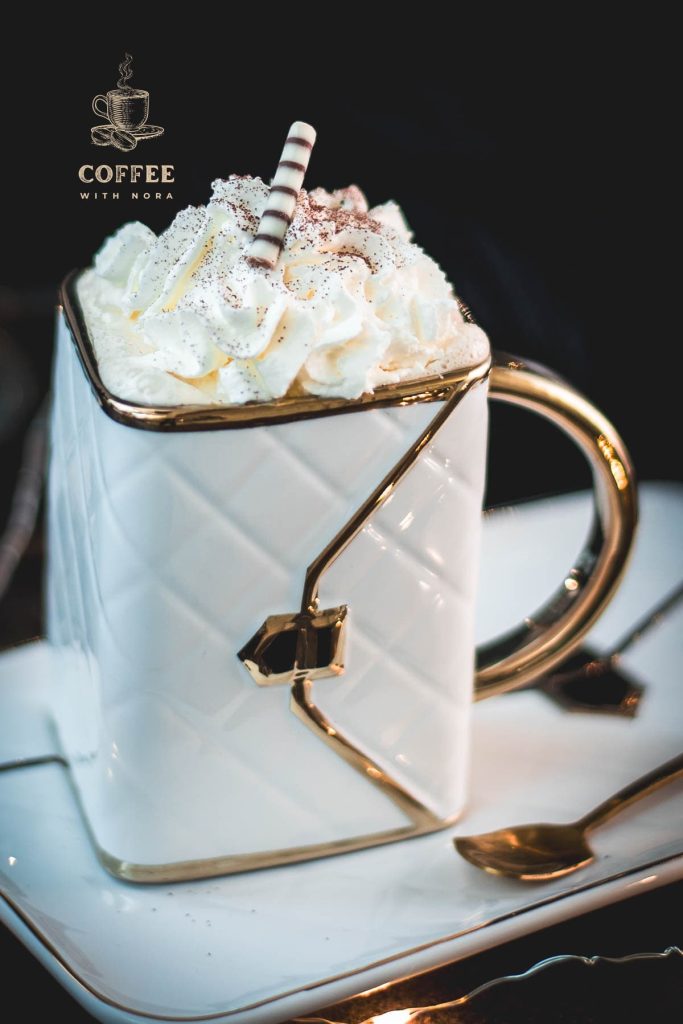 Gorgeous eggnog coffee, served in a handbag coffee mug. Topped with whipped cream and garnished with cocoa powder or nutmeg.