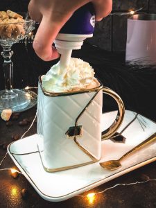 Garnish your eggnog coffee with whipped cream.