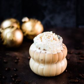 Gorgeous iced eggnog latte, topped with whipped cream and dusted with nutmeg. So festive.