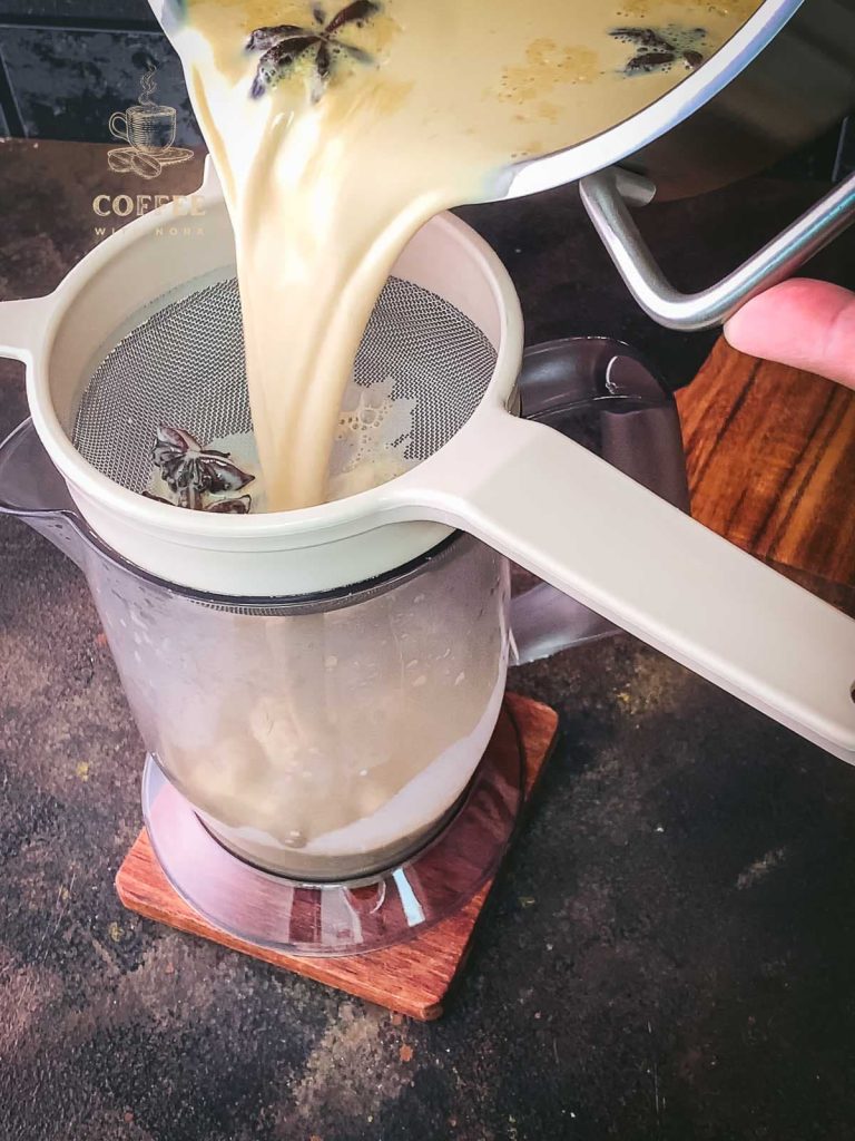 Strain the Christmas coffee creamer into a jug.