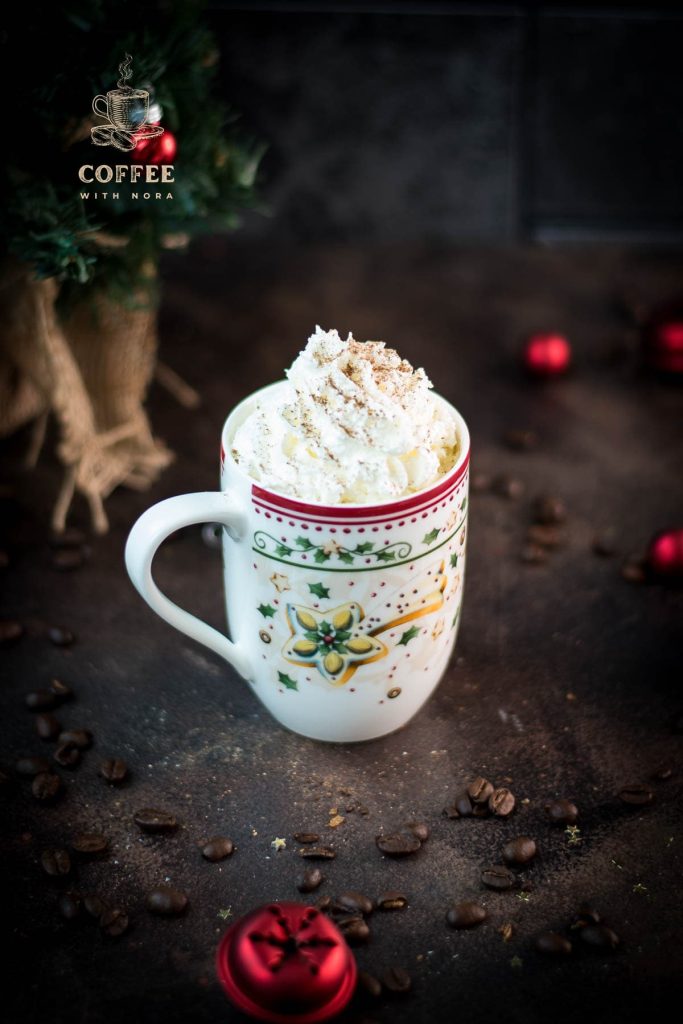 Gorgeous eggnog latte in cut Christmas coffee mug.