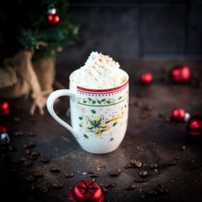 Gorgeous eggnog latte in cut Christmas coffee mug.