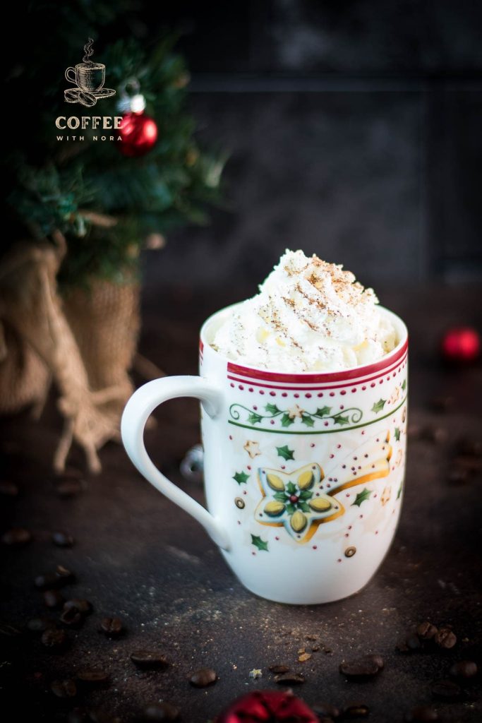 Gorgeous eggnog latte in cut Christmas coffee mug.