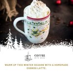 Gorgeous eggnog latte in cut Christmas coffee mug.