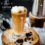 Gorgeous image of a high coffee glass, filled with iced coffee. The beautiful snowflake shaped milk ice cubes make this treat even more appealing.