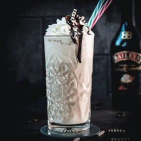 Scrumptious Baileys Salted Caramel Whipped Cream as a topping for a delicious Baileys Iced Coffee.