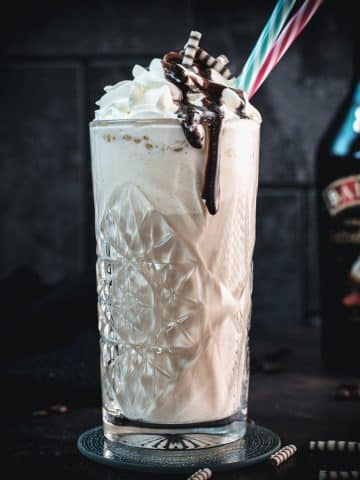 Scrumptious Baileys Salted Caramel Whipped Cream as a topping for a delicious Baileys Iced Coffee.