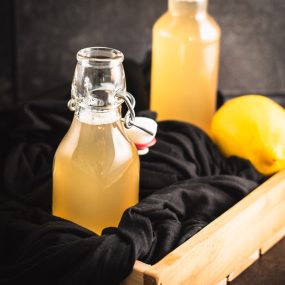 Preserving bottle filled with delicious lemon ginger syrup.