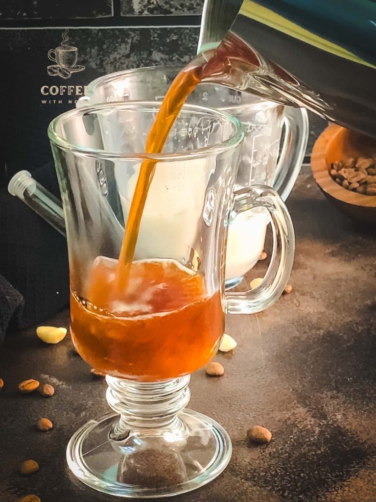 Pour coffee into the serving glass.