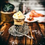 Gorgeous espresso whipped cream, topping an espresso and served in an medieval glass cup. The delicious texture also makes the espresso whipped cream a feast for the eyes!