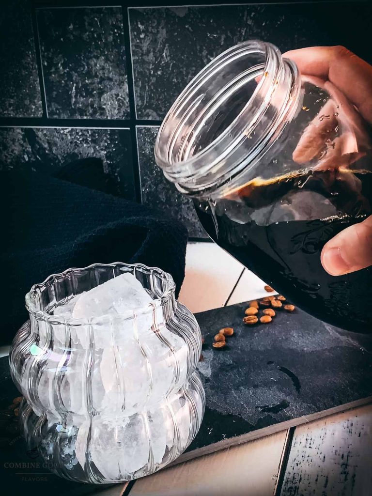 Pour the finished cold brew coffee into your serving glass.