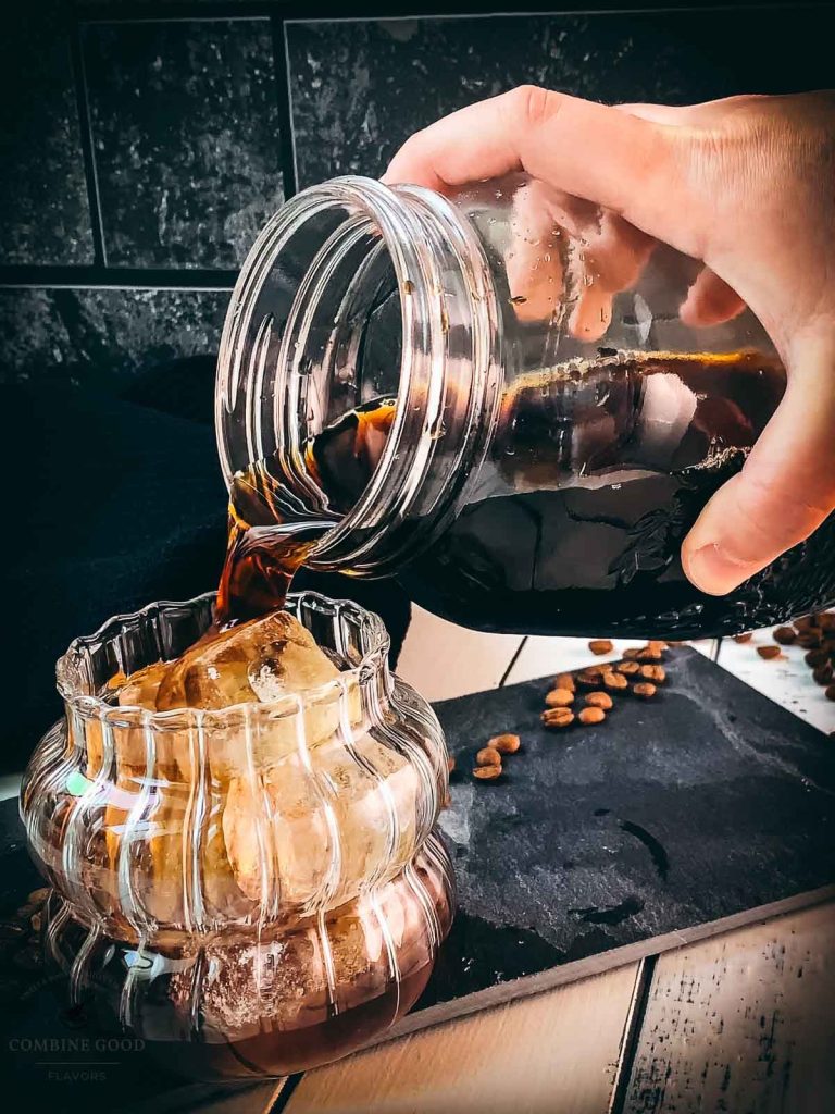 Pour the finished cold brew coffee into your serving glass.