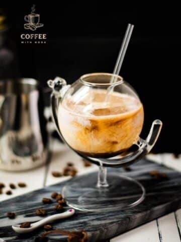 Gorgeous marbled cold brew white Russian made with half-and-half, placed on marbled plate.