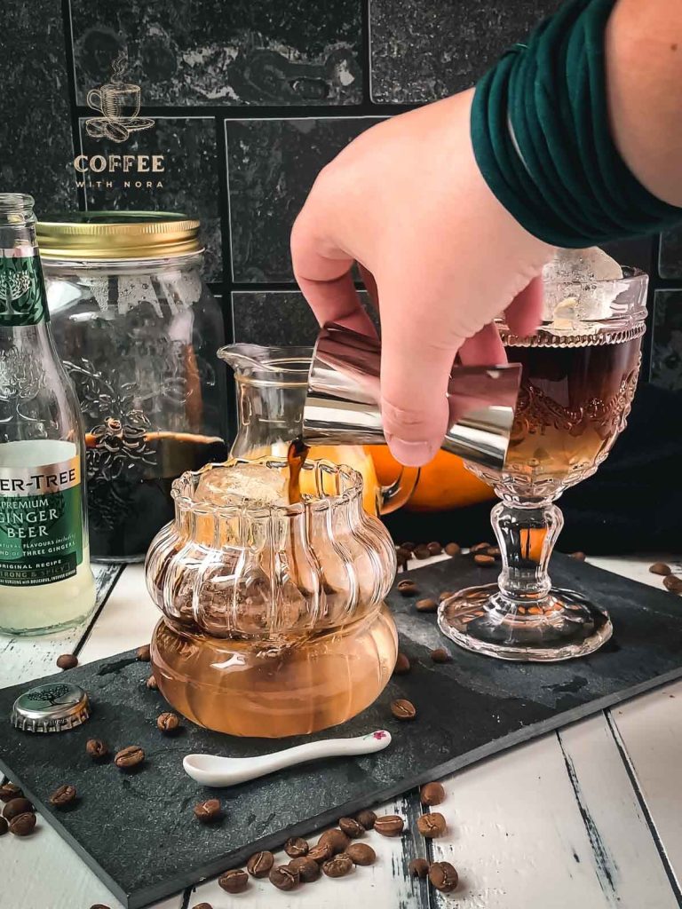 Pour cold brew into the glass filled with ginger beer.