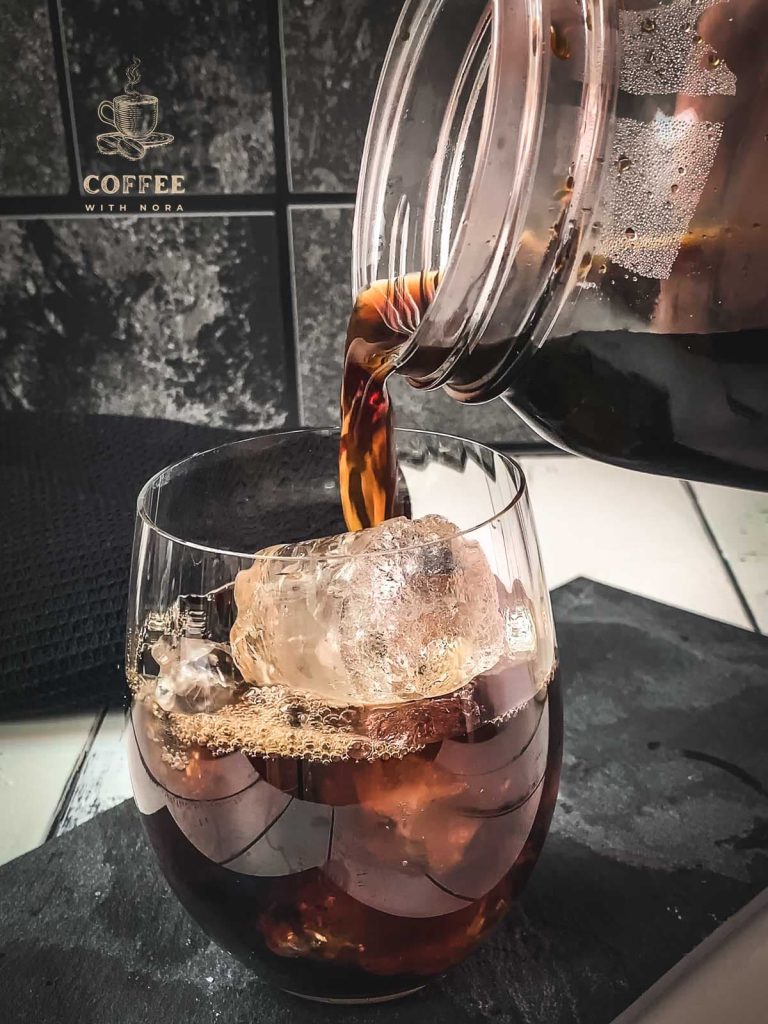 Pour the homemade cold brew into the ice cube filled glass.