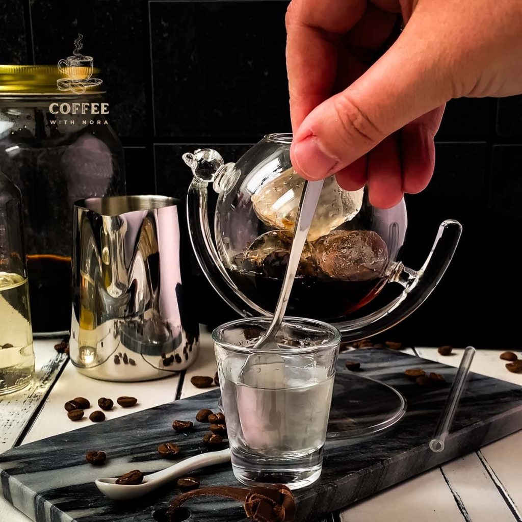 Stirring the vodka sugar syrup mix to combine well.