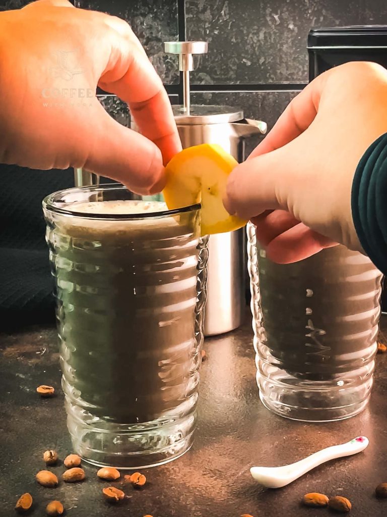 Place a slice of banana on the glass rim as a garnish.