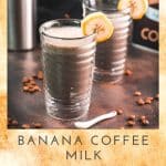 Two glasses filled with delicious, nutritious banana milk coffee. Garnished with a slice of banana. Perfect to start the day or as a pre-workout snack!