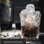 Gorgeous cold brew black Russian served in a rocks glass and placed on a marbled plate.