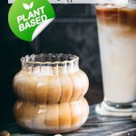 Two gorgeous glasses filled with delicious almond milk latte, placed on marbled plate