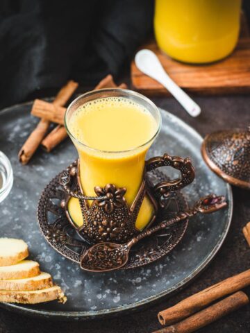 Gorgeous medieval coffee cup filled with delicious spiced almond milk.