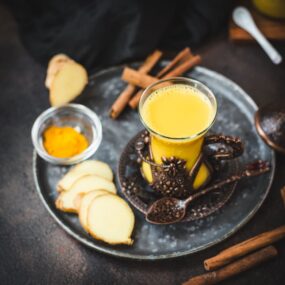 Gorgeous medieval coffee cup filled with delicious spiced almond milk.