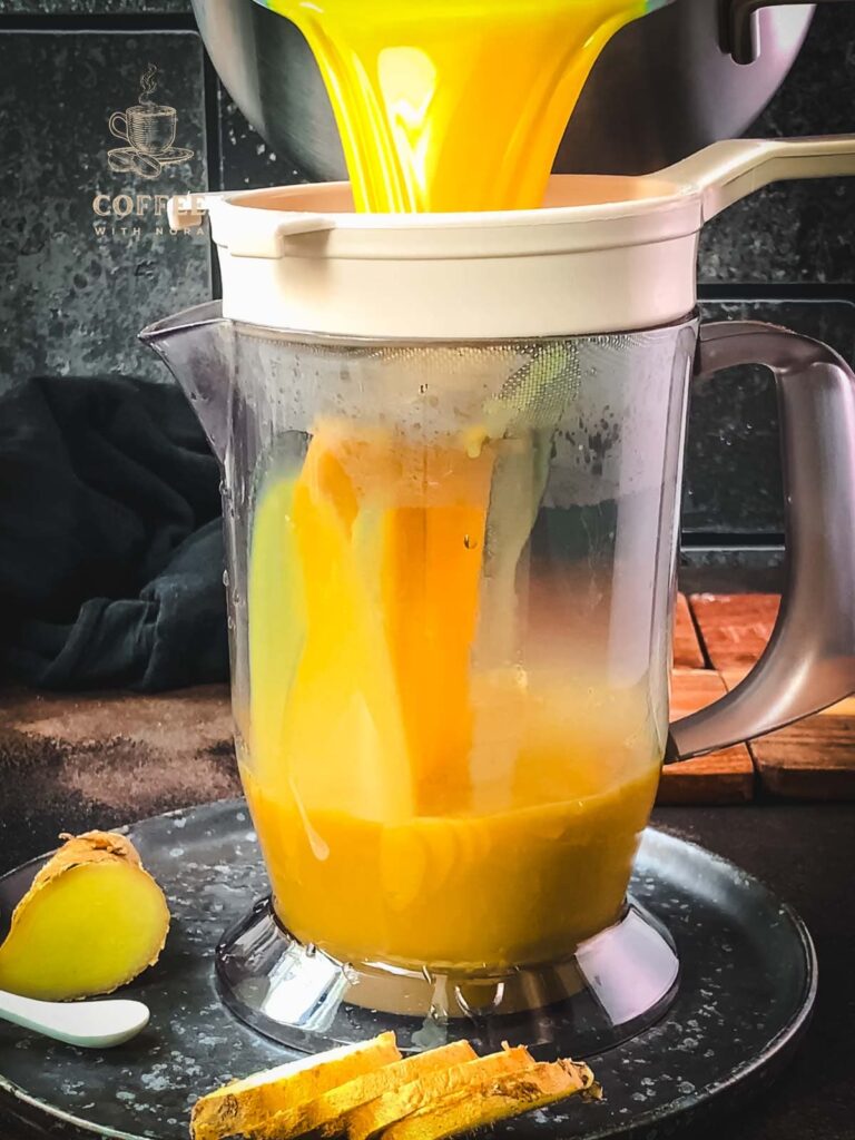 Strain the spiced milk through a close meshed sieve into a tall container.