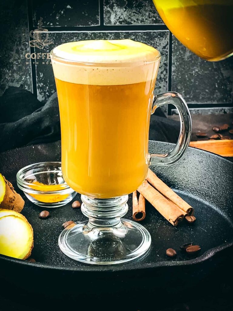 Top your turmeric coffee with frothed turmeric milk.