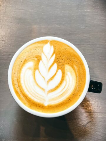 Cappuccino cup with a latte heart leaf.