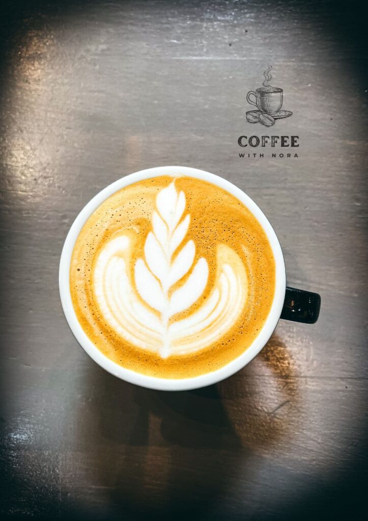 Cappuccino cup with a latte heart leaf.