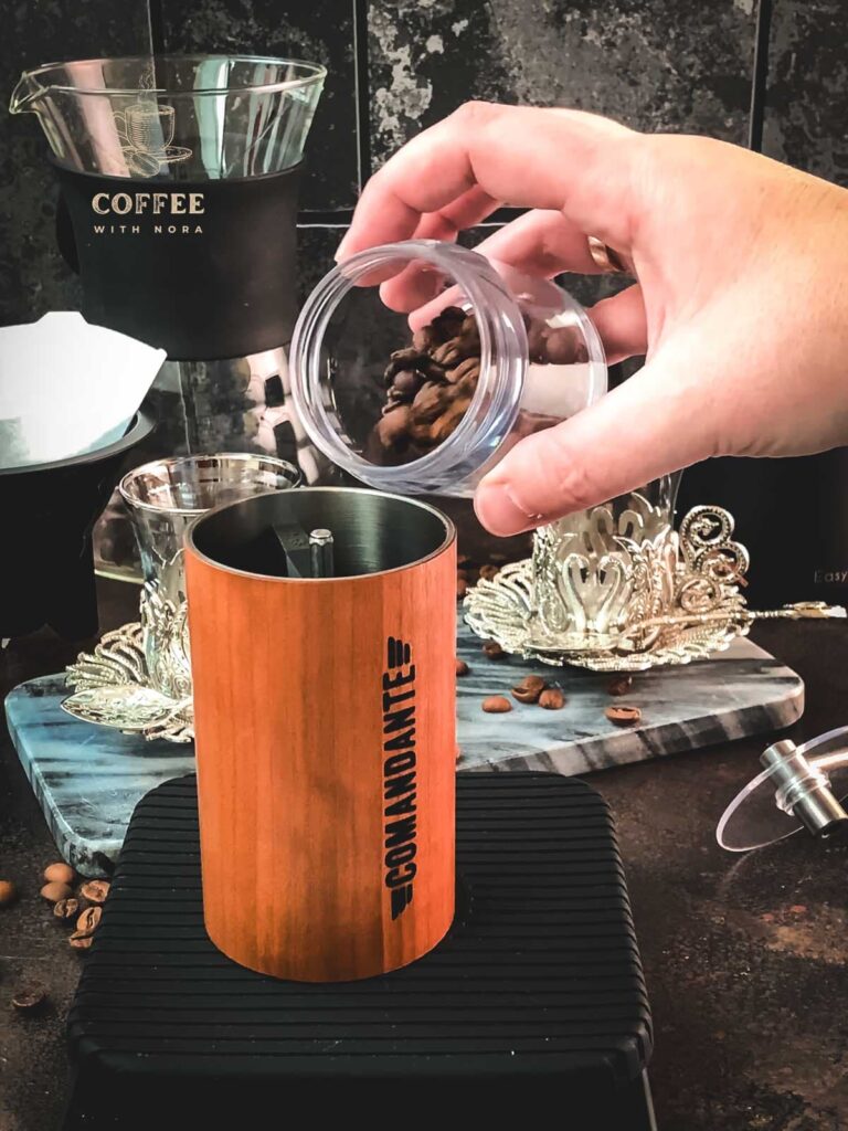 Fill the coffee beans into your manual coffee grinder.