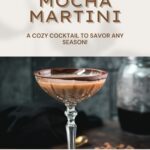 Creamy mocha martini in gorgeous glass, placed on glass coaster on dark ground.