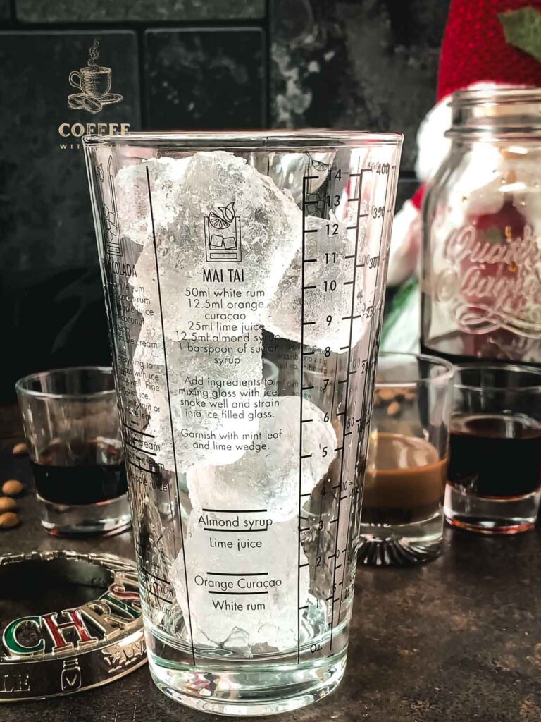 Cocktail shaker filled with cubed ice.