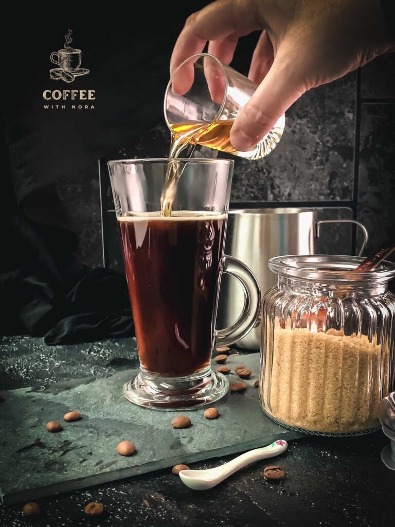 Add Irish whiskey to your sweetened coffee.