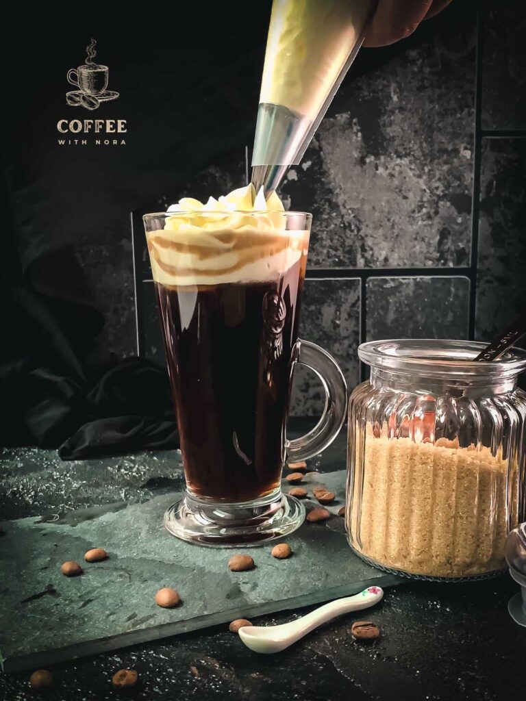 Pipe the sweetened whipped cream on top of your Irish coffee.