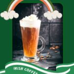 Delicious Irish coffee, topped with whipped cream and sprinkled with cocoa powder, placed on black slate plate.