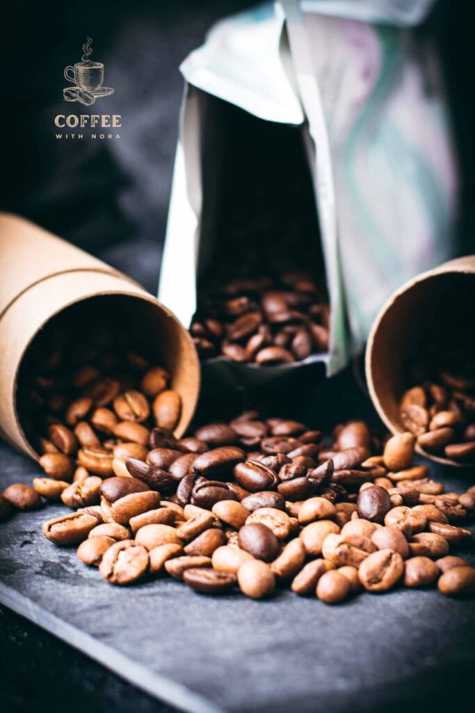 Black slate plate with three different kinds of coffee beans.