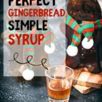 Easy homemade gingerbread simple syrup for coffees and cocktails in a small glass, placed next to two gingerbread man.