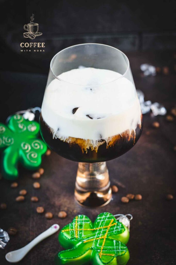 Gorgeous serving glass, filled with delicious iced irish coffee (made with homemade cold brew). Floating on top, a decadent slightly whipped cream.