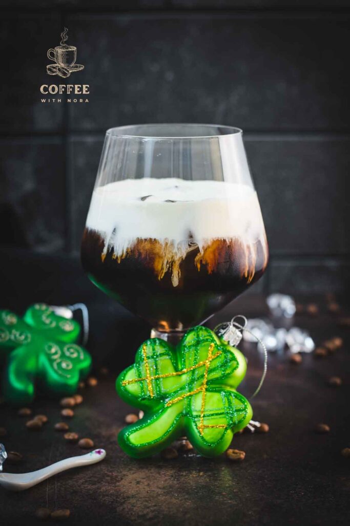 Gorgeous serving glass, filled with delicious iced irish coffee (made with homemade cold brew). Floating on top, a decadent slightly whipped cream.