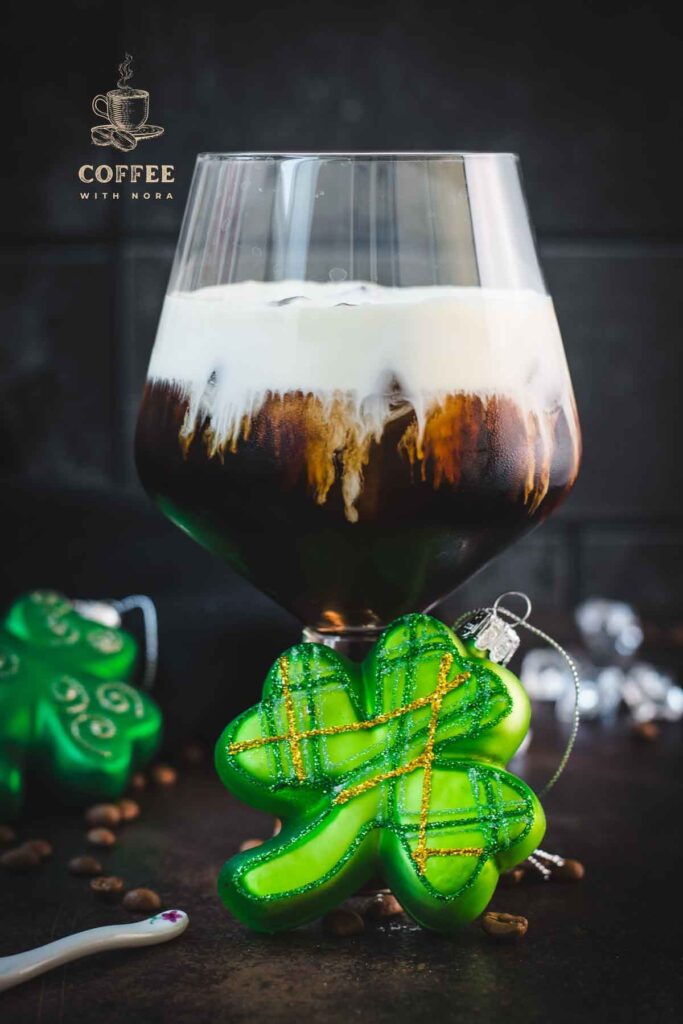 Gorgeous serving glass, filled with delicious iced irish coffee (made with homemade cold brew). Floating on top, a decadent slightly whipped cream.